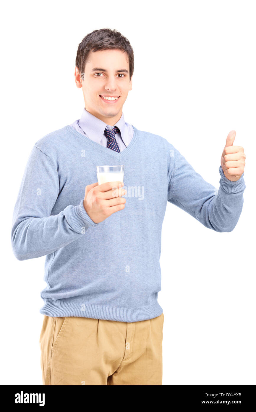 Man holding a glass of milk and giving thumb up Stock Photo - Alamy