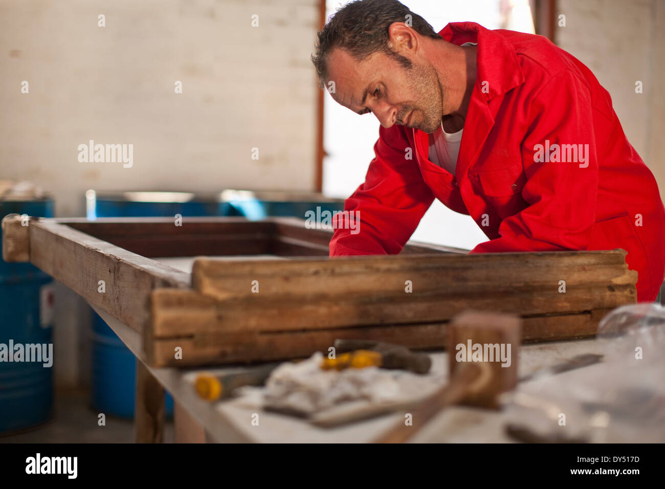 Frame carpenter working on frame hires stock photography and images