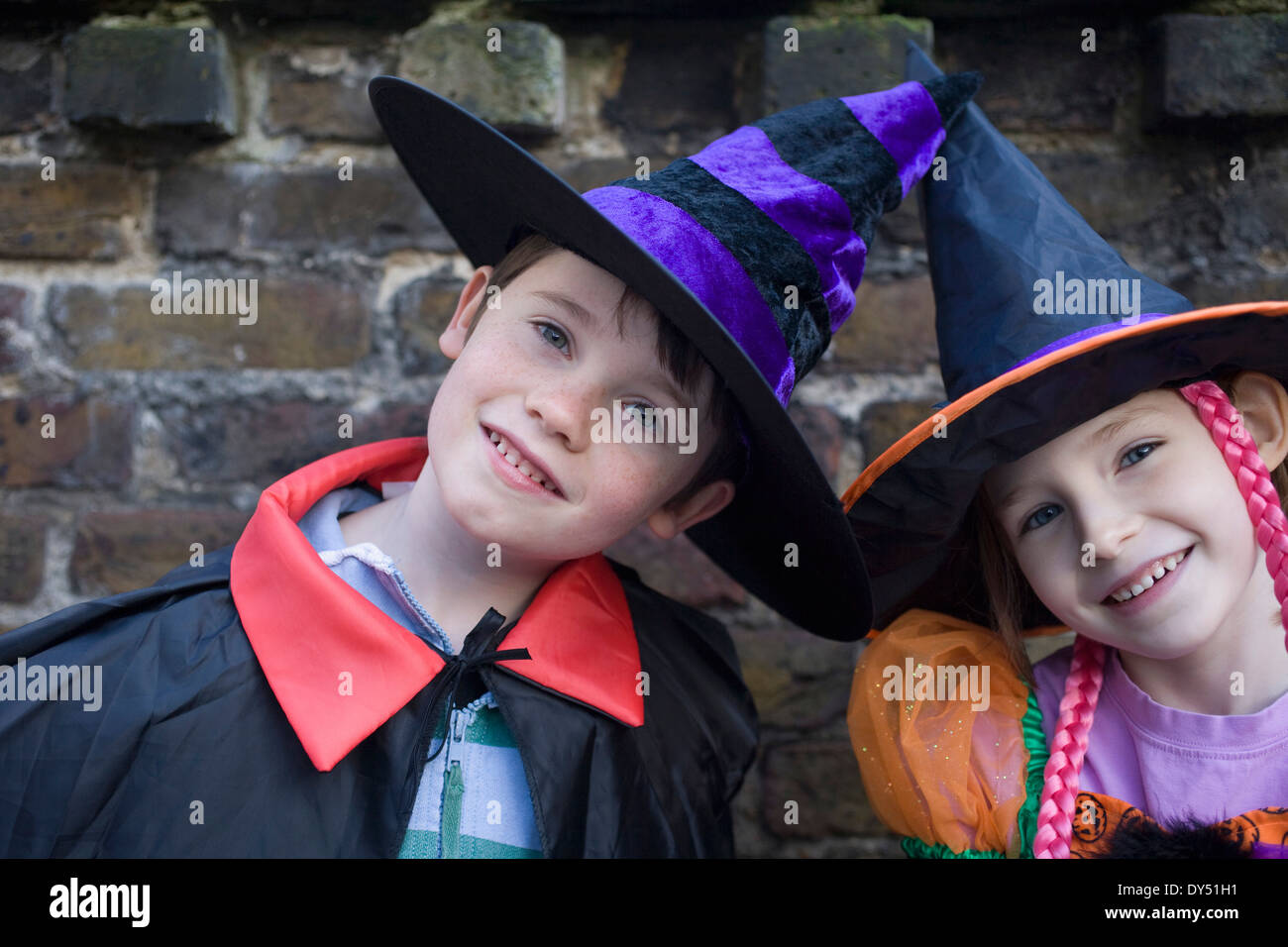 Portrait of boy and girl in halloween costumes Stock Photo