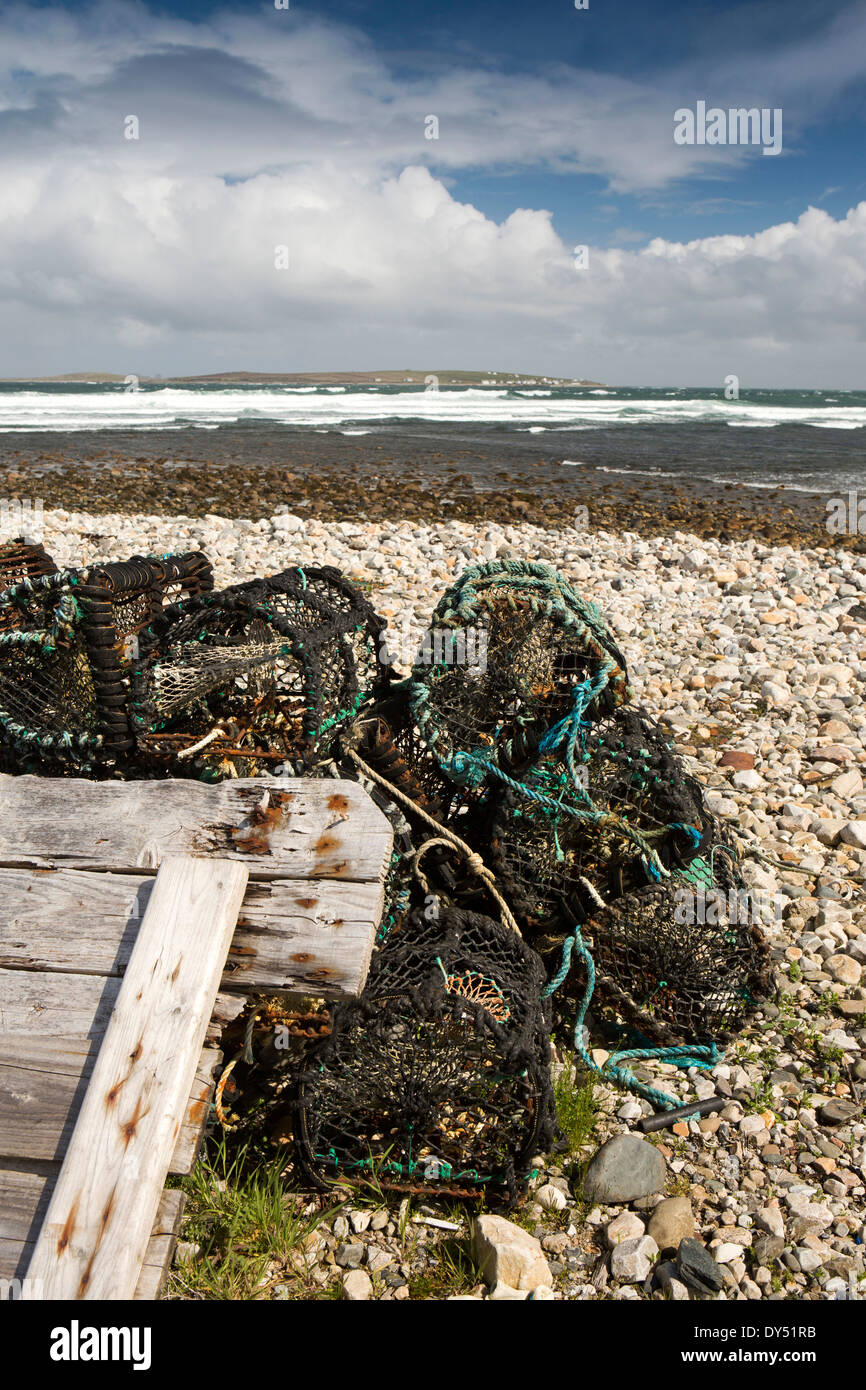 Ireland, Co Donegal, Gweedore, Meenaclady, Lobster pots on the shingle