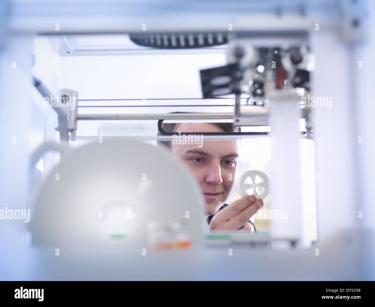 Apprentice with 3D printed part, close up Stock Photo