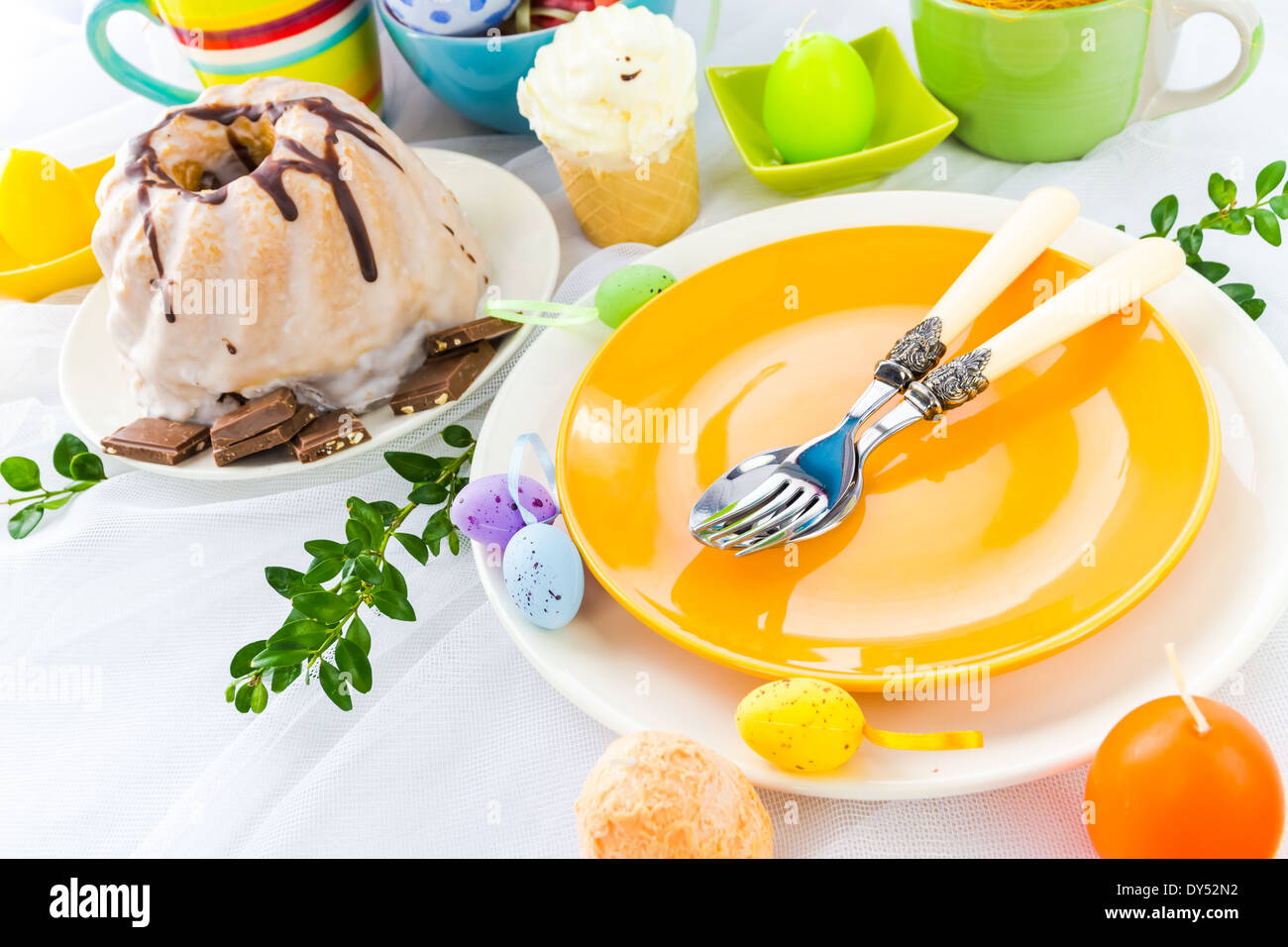 Easter table arrangement with eggs and sweets Stock Photo