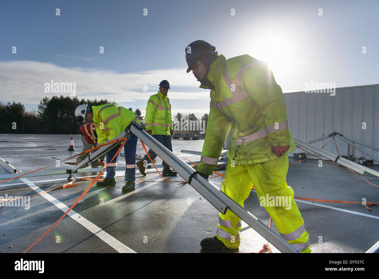 Emergency Response Team workers erecting tent control centre Stock Photo