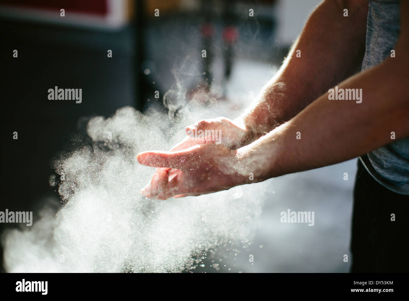 Man putting chalk on his hands Stock Photo Alamy