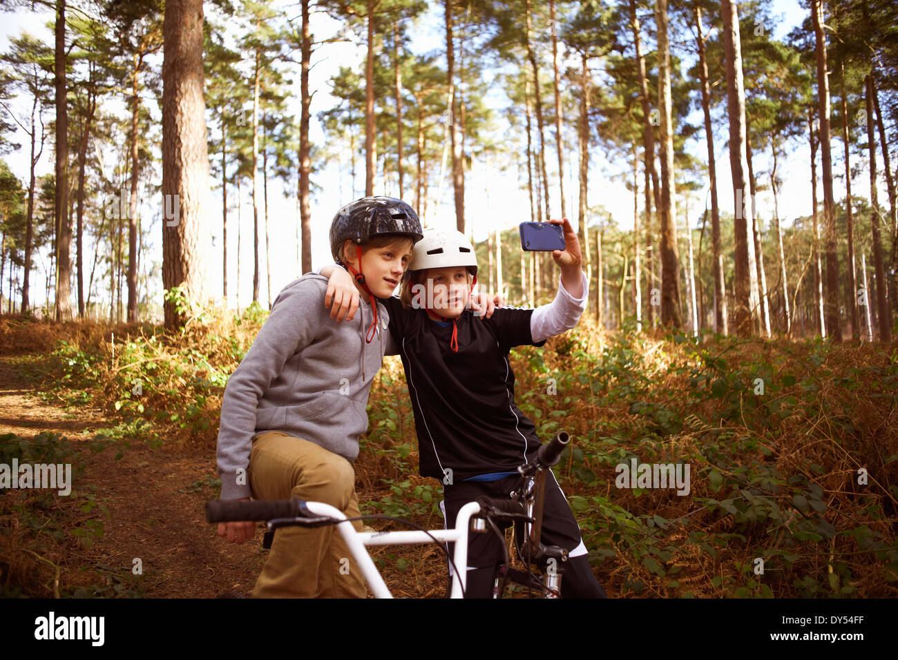 Twin brothers on BMX bikes taking self portrait Stock Photo