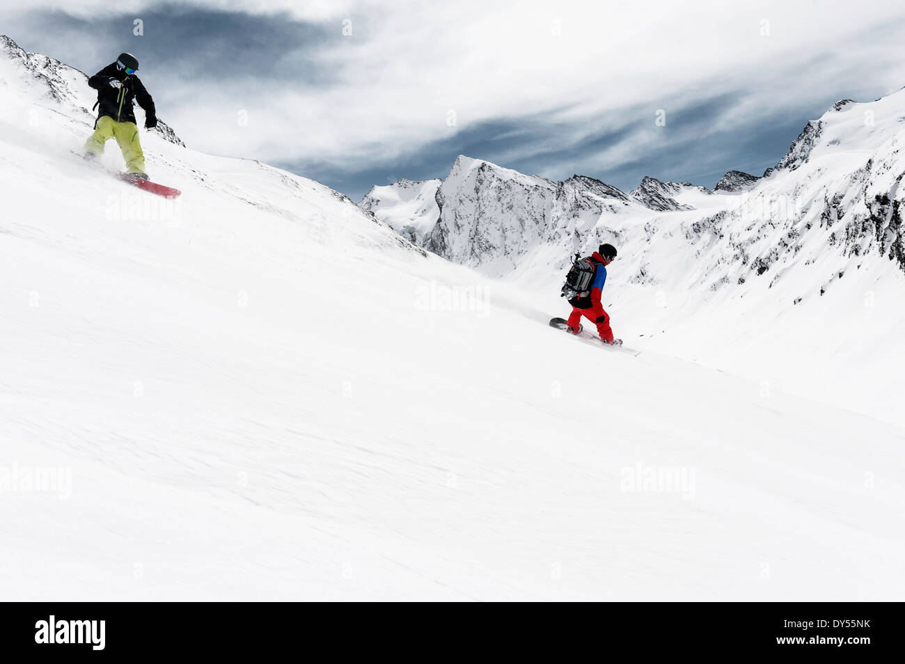 Two men snowboarding downhill hi-res stock photography and images - Alamy