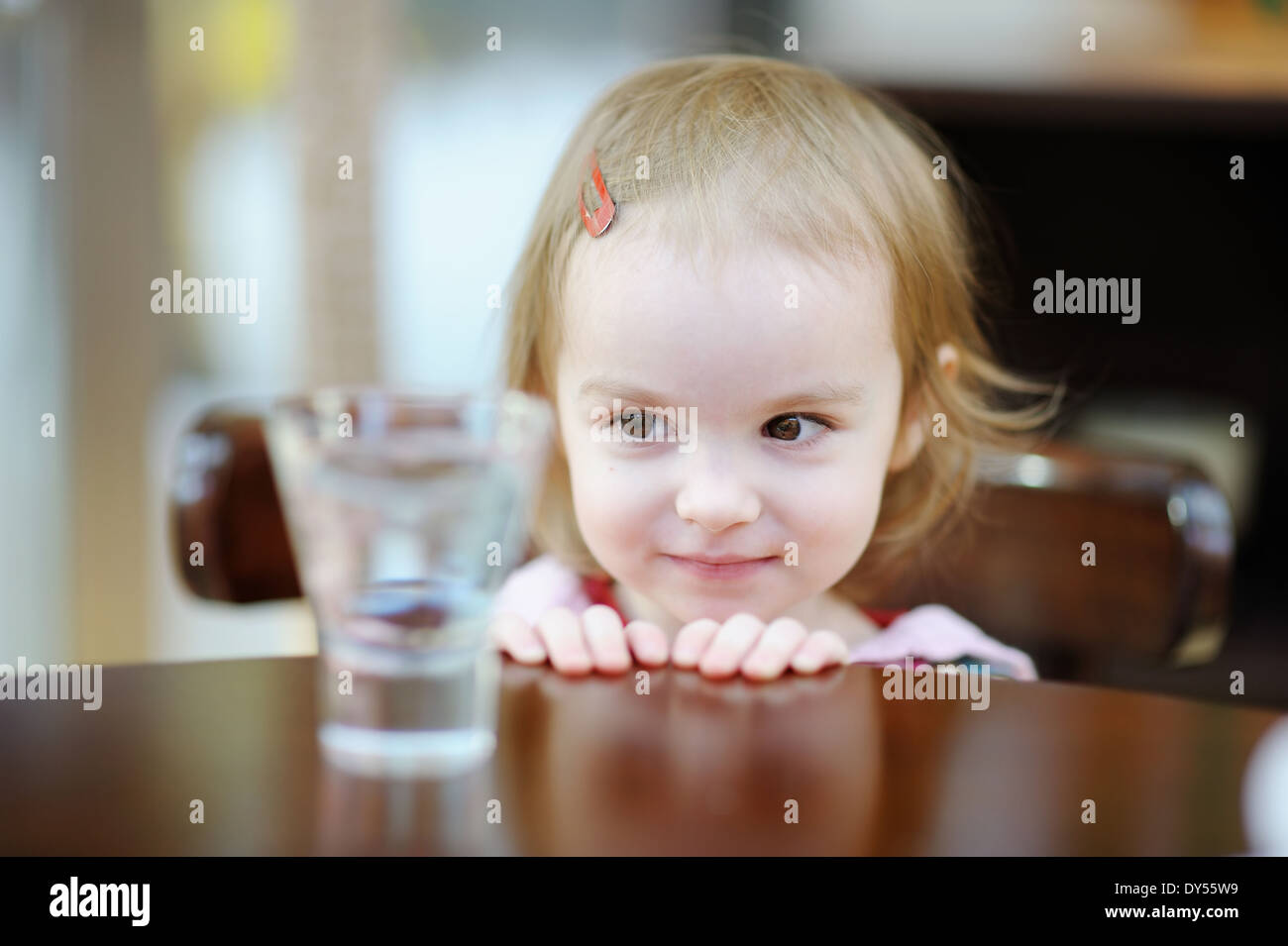 Adorable smiling toddler girl at indoor cafe Stock Photo Alamy