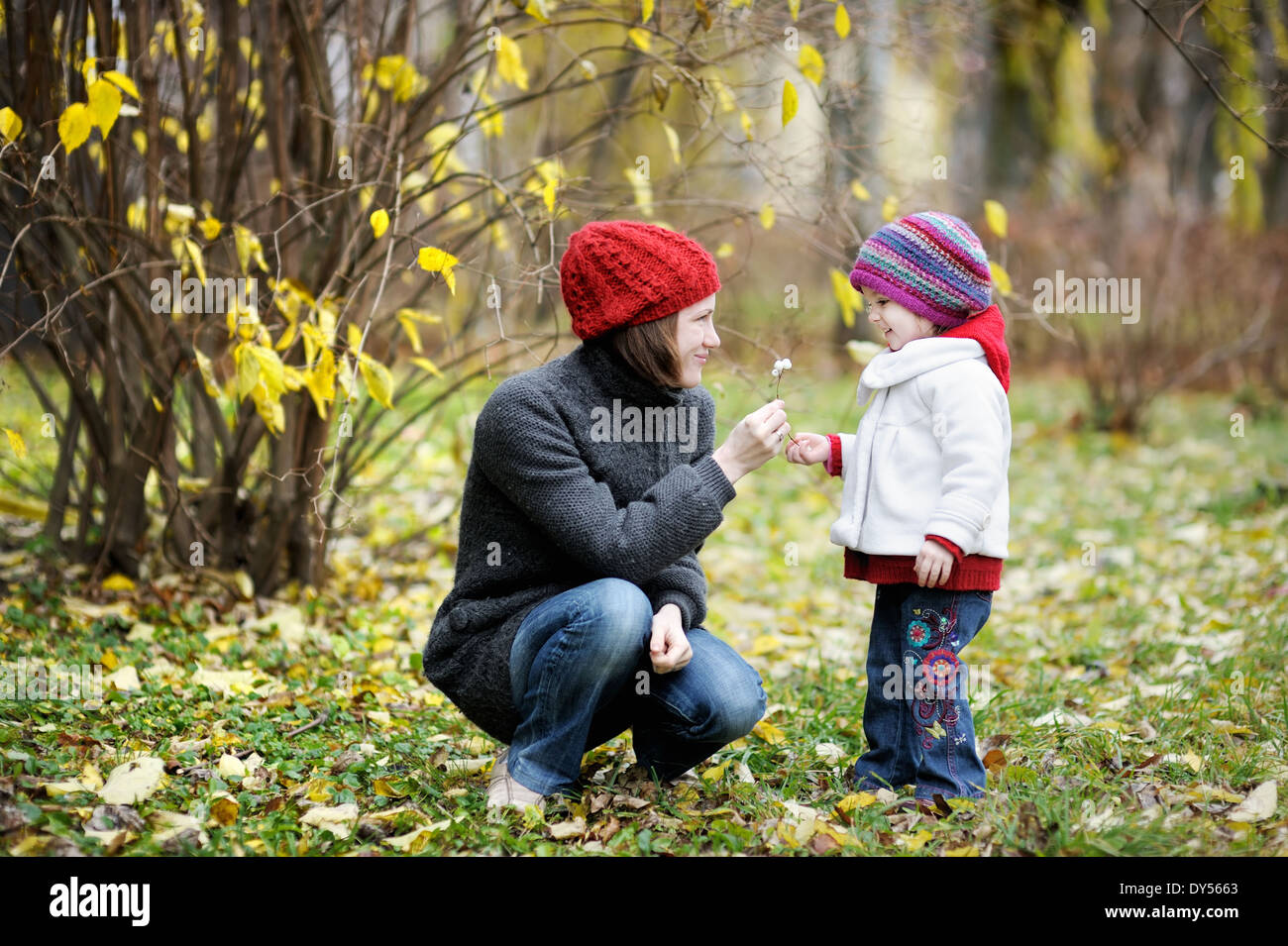 Young mother and her toddler girl having fun in autumn Stock Photo - Alamy