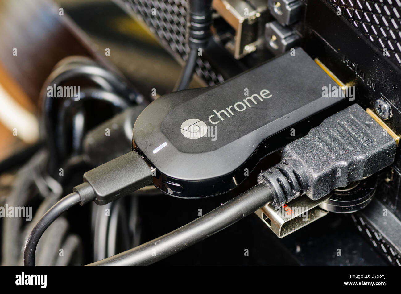 Google Chromecast TV streaming device plugged into the HDMI port of a  television Stock Photo - Alamy