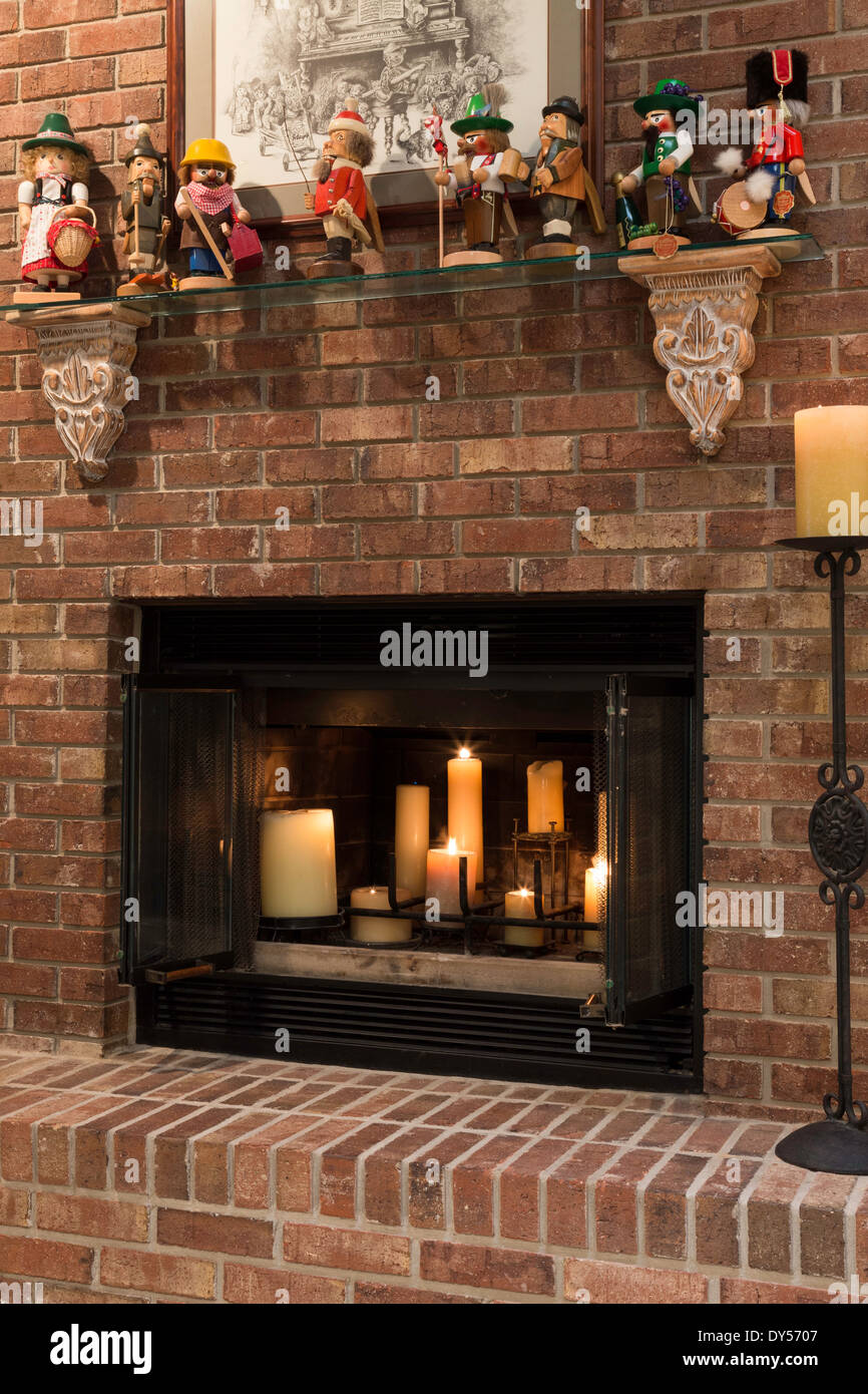 Fireplace with Candles Burning and Collection of Decorative Nutcrackers