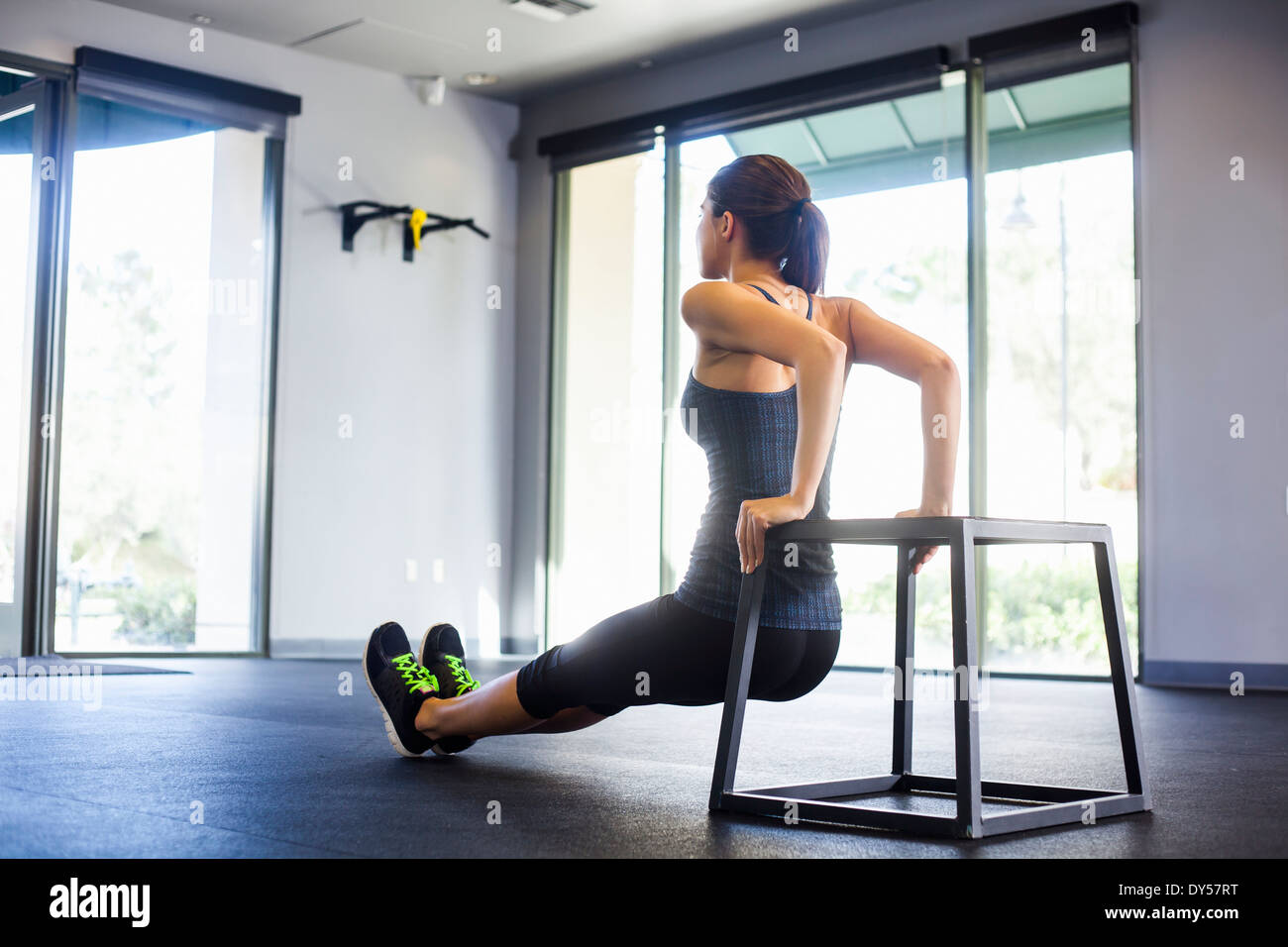 Young woman doing push ups Stock Photo