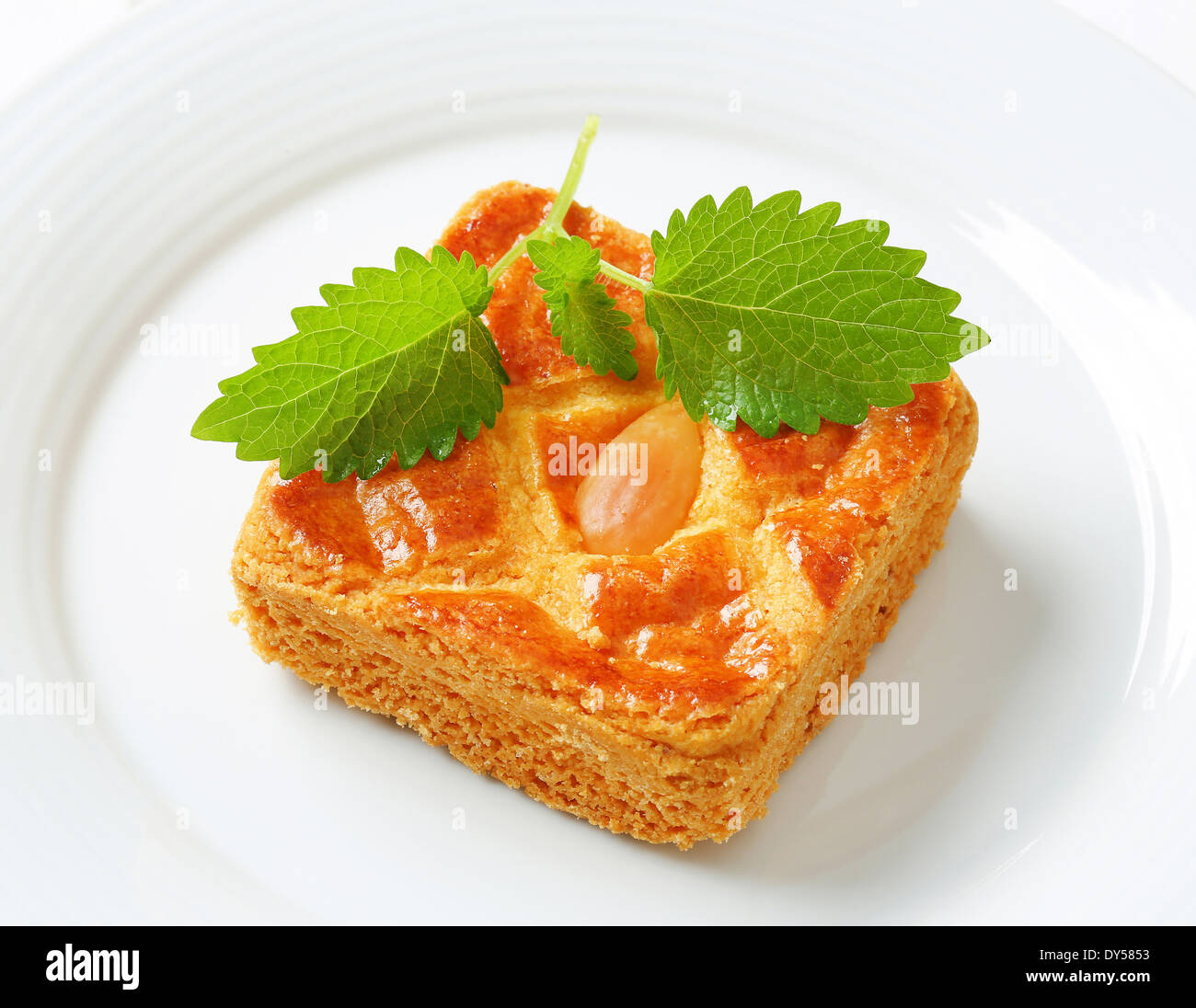 Small square cake filled with thick almond paste Stock Photo Alamy