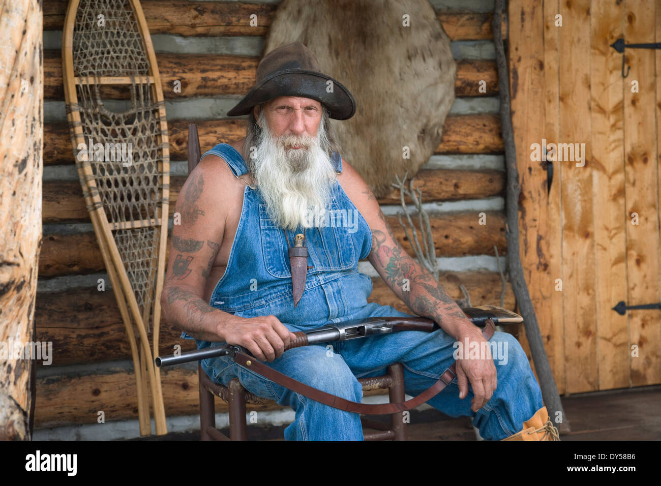 [Image: old-timer-sits-on-front-porch-of-a-rusti...DY58B6.jpg]