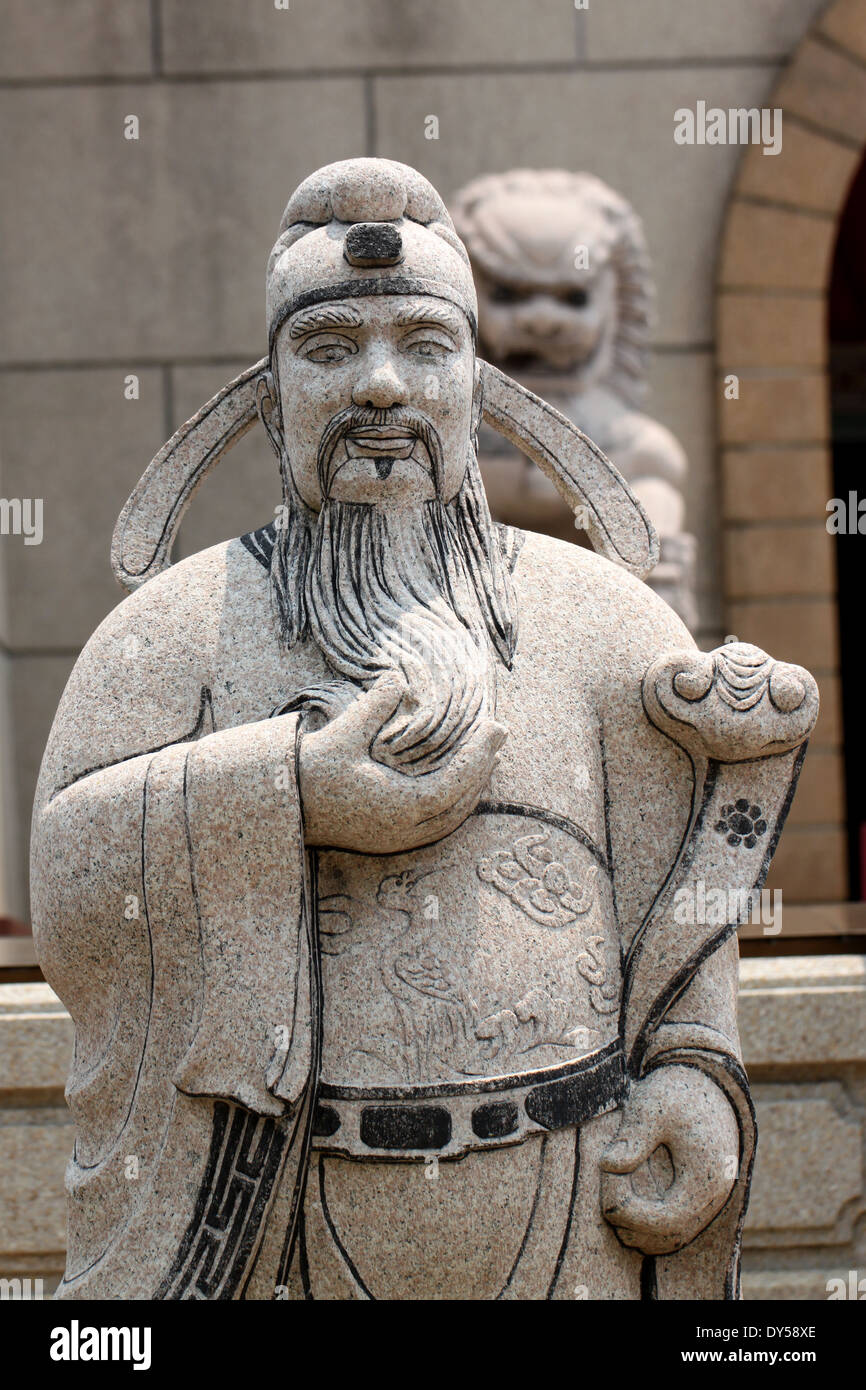 Statues of Chinese deity and lion sculpture in chinese temple Stock
