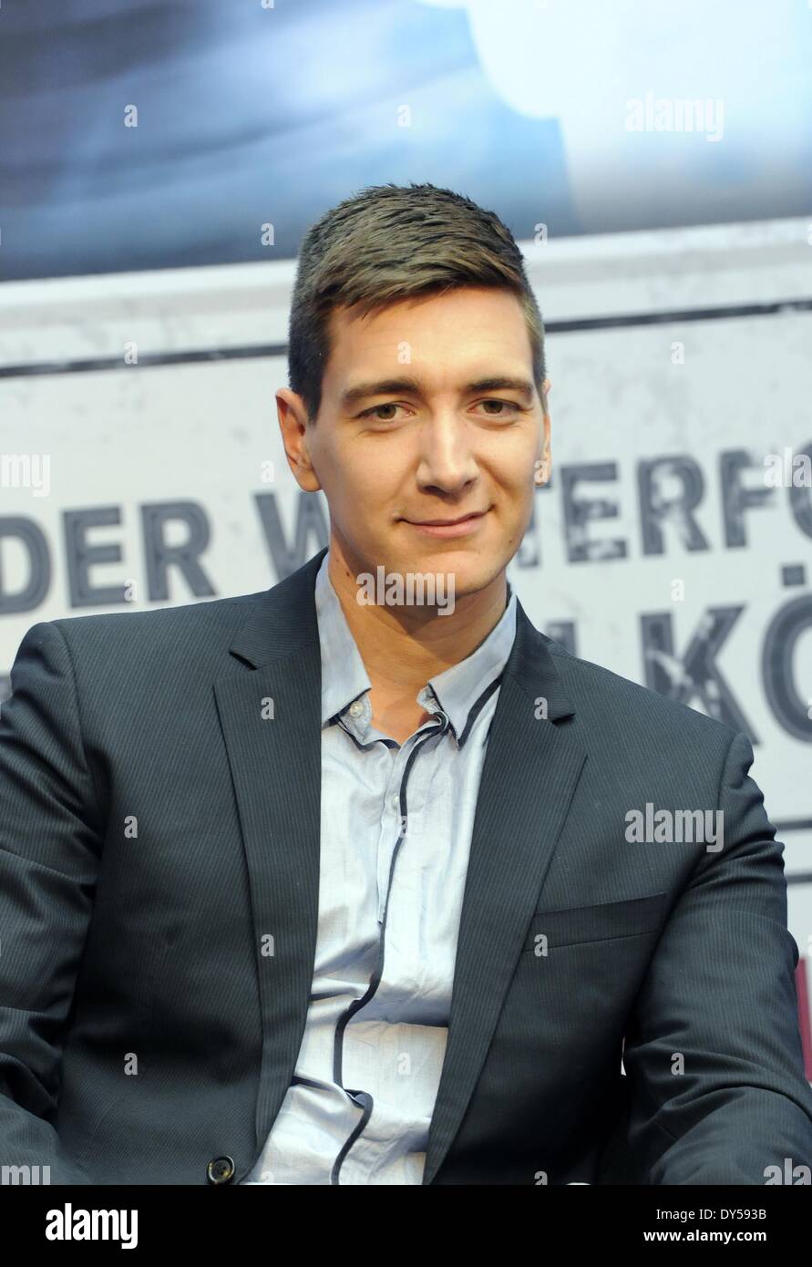 Cologne, Germany. 04th Apr, 2014. British actor Oliver Phelps, who played one of the Weasley twins in the Harry Potter film series, poses in the Odysseum Adventure Museum after the press conference for 'Harry Potter: The Exhibition' in Cologne, Germany, 04 April 2014. The exhibition will open on 03 October 2014. Photo: Horst Galuschka/dpa -NO WIRE SERVICE/KEIN BILDFUNK-/dpa/Alamy Live News Stock Photo