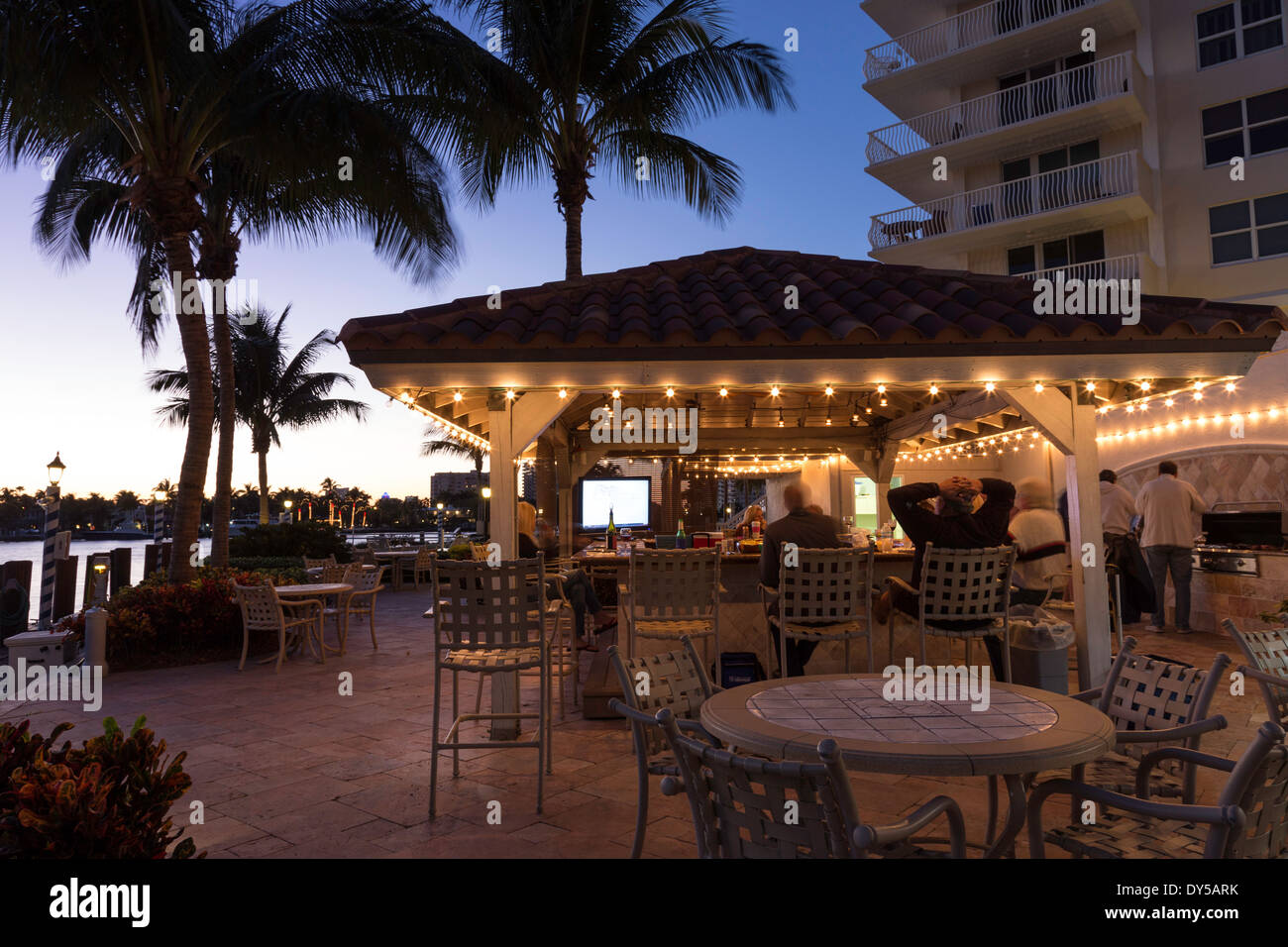 Tenants Enjoying the Tiki Bar Cabana, The Venetian Apartment Buildings, Fort Lauderdale, FL, USA Stock Photo