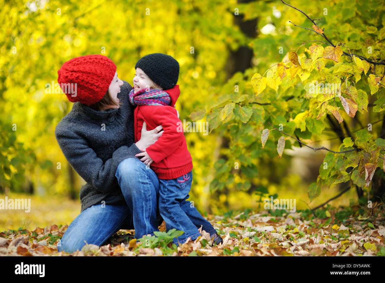 Young mother and her toddler girl in autumn fields Stock Photo - Alamy