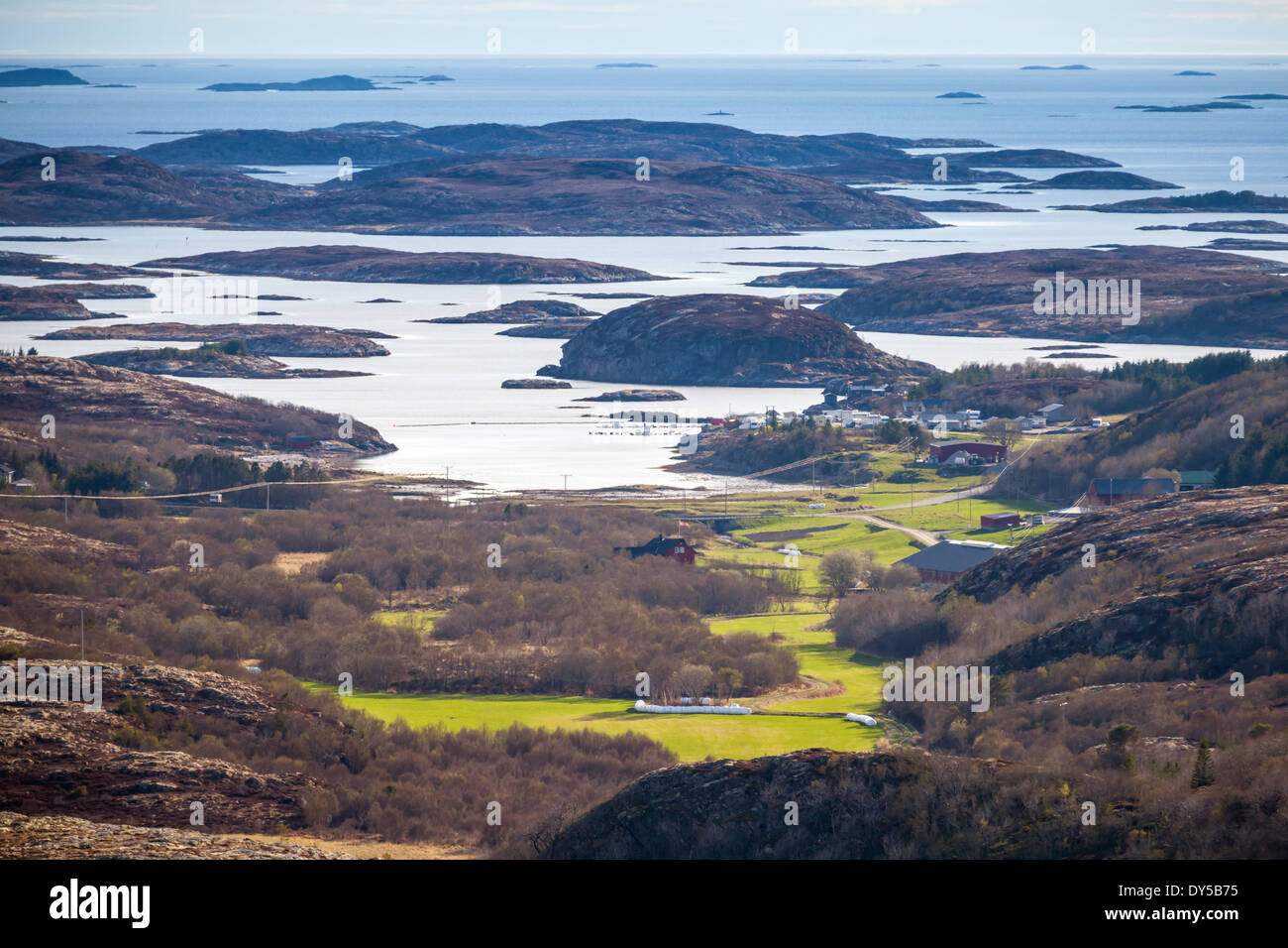 Norwegian coastal landscape with sea, islands and spring field Stock Photo