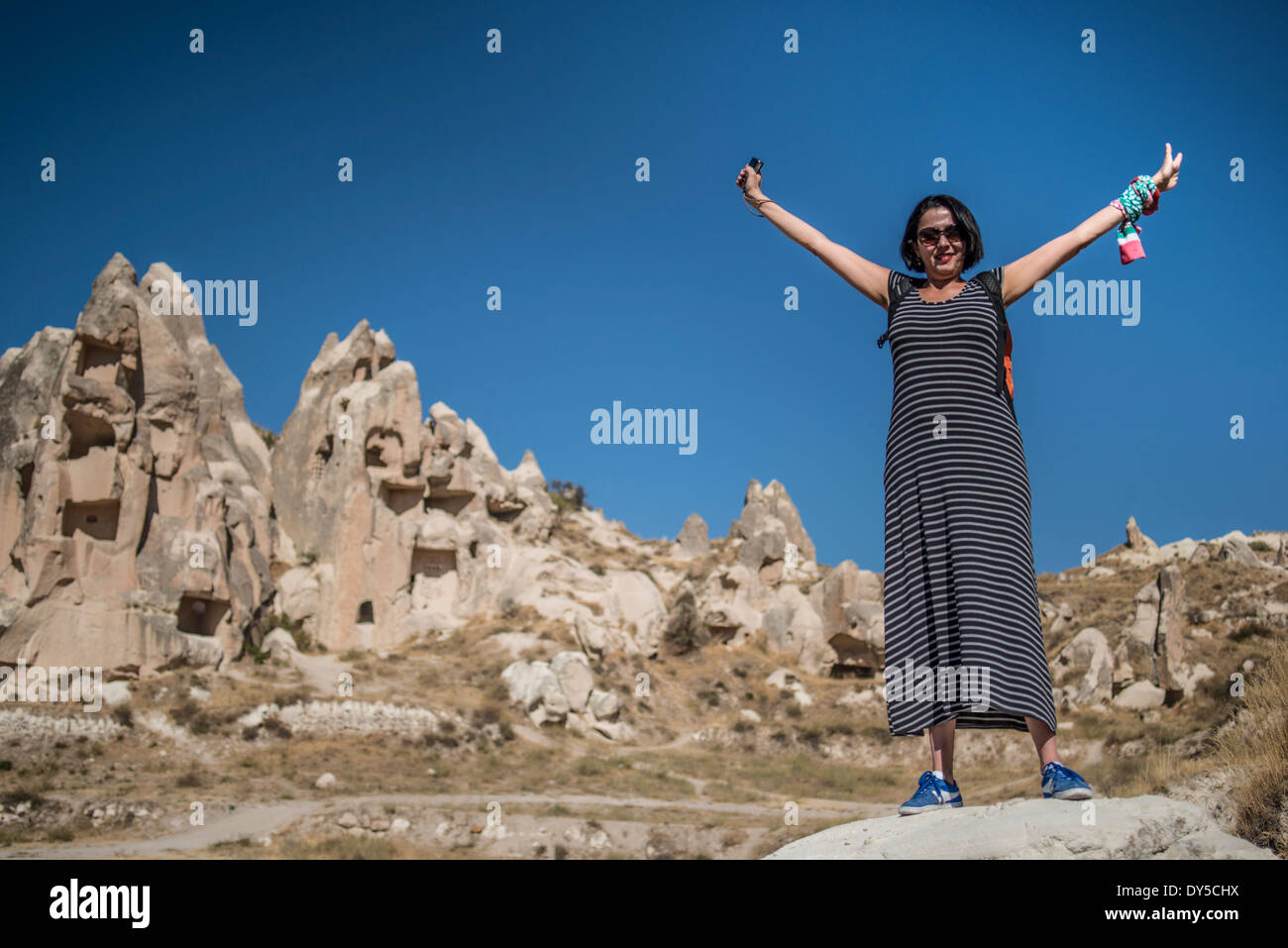 A turist at visiting the Goreme National Park in Cappadocia, Anatolia, Turkey. Stock Photo