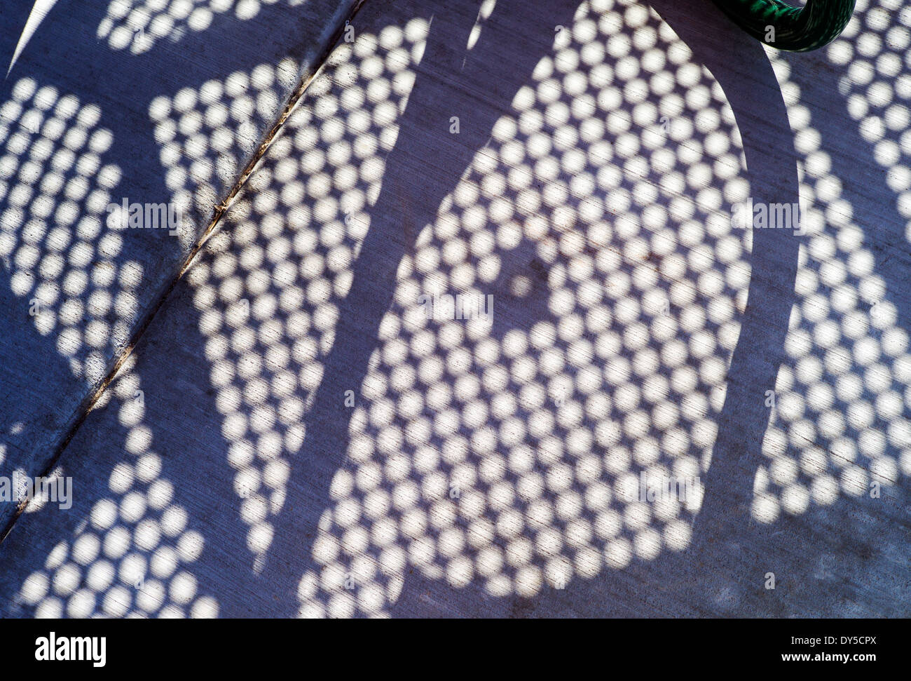 Abstract photograph of colorful red patio table and bench Stock Photo