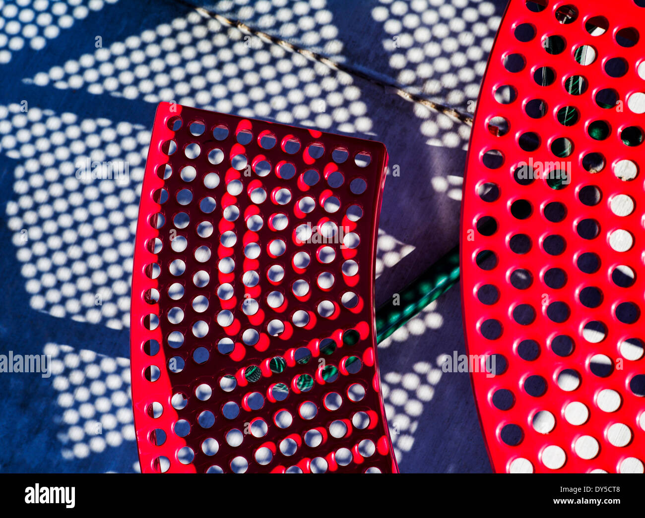 Abstract photograph of colorful red patio table and bench Stock Photo