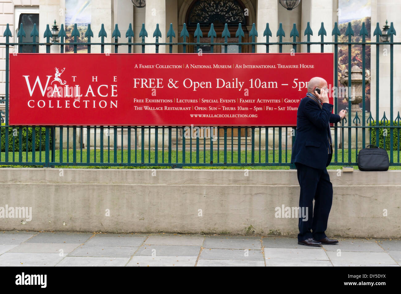 Man using his mobile 'phone outside the Wallace Collection in London. Stock Photo