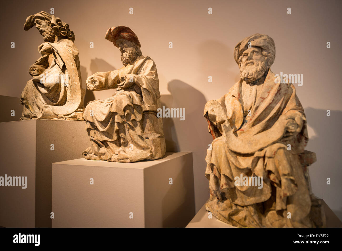 Historic statues on display at the Museum of the City of Brussels. The museum is dedicated to the history and folklore of the town of Brussels, its development from its beginnings to today, which it presents through paintings, sculptures, tapistries, engravings, photos and models. Stock Photo