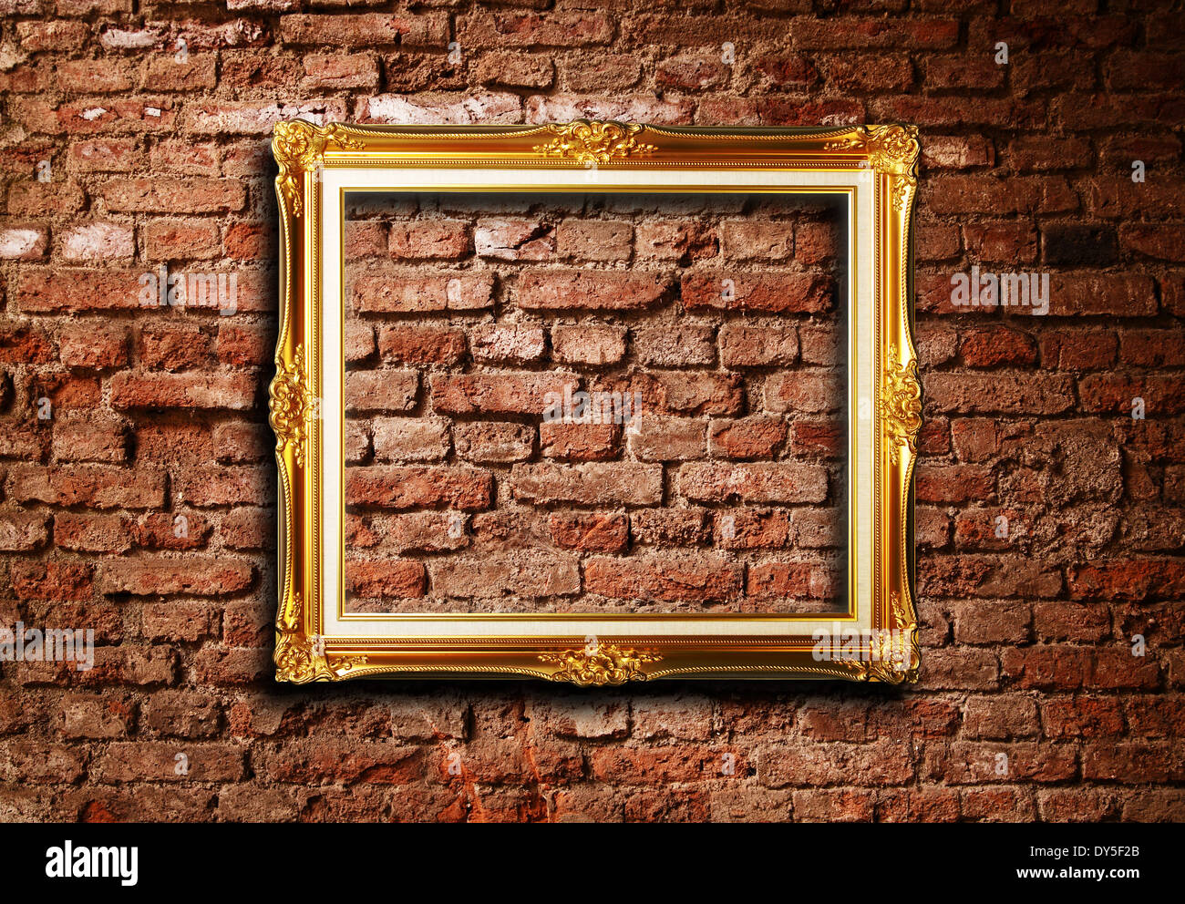 Golden picture frame against grunge brick wall texture Stock Photo Alamy