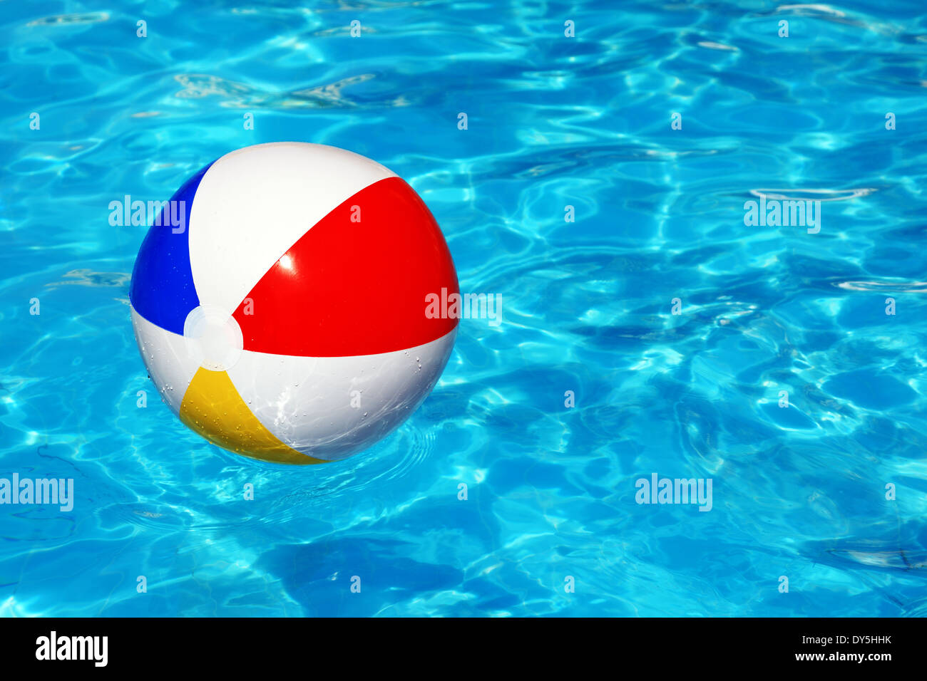 Beach ball in swimming pool Stock Photo