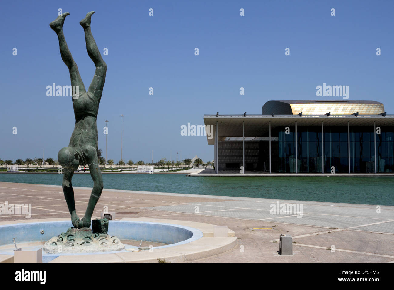 Statue of a pearl diver at the Bahrain National Museum with the Stock