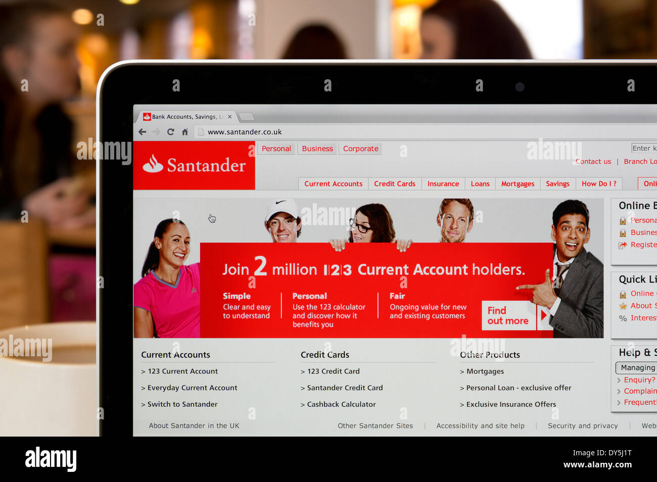 The Sanatander website shot in a coffee shop environment (Editorial use only: print, TV, e-book and editorial website). Stock Photo