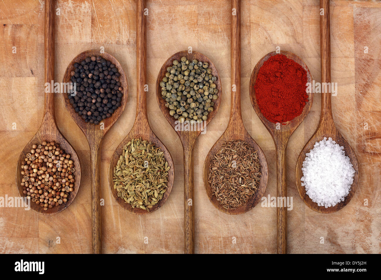 Spices on wooden spoons Stock Photo