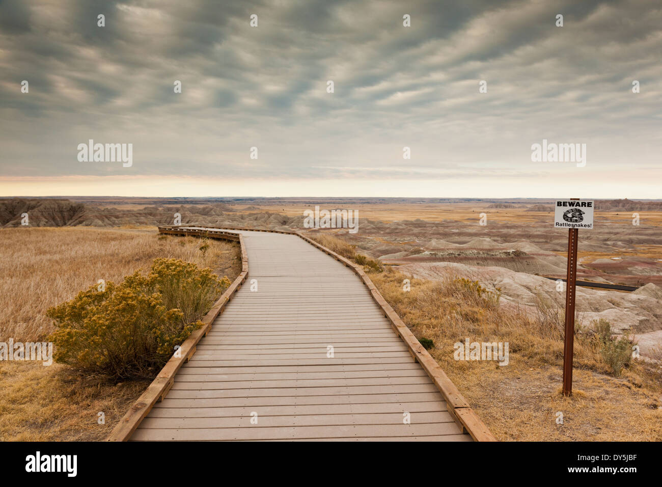 USA, South Dakota interior, Badlands National Park, Bigfoot Pass Overlook area, pathway and Rattlesnake warning sign Stock Photo