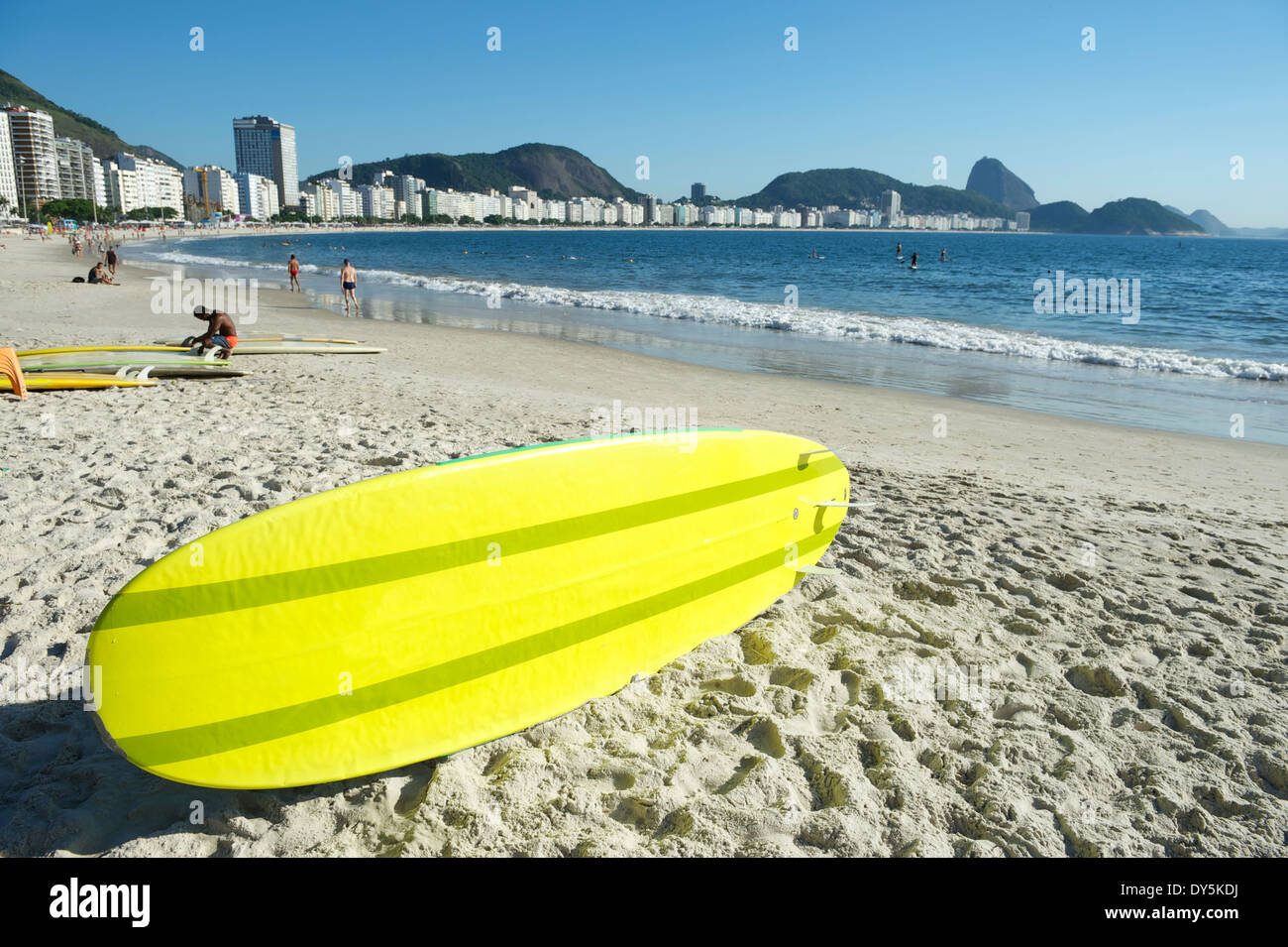 Yellow stand up paddle long board surfboard on Copacabana Beach Rio de