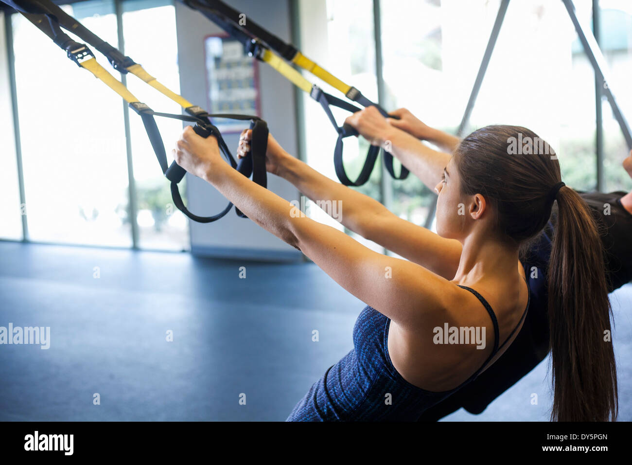 Couple working out in gym Stock Photo