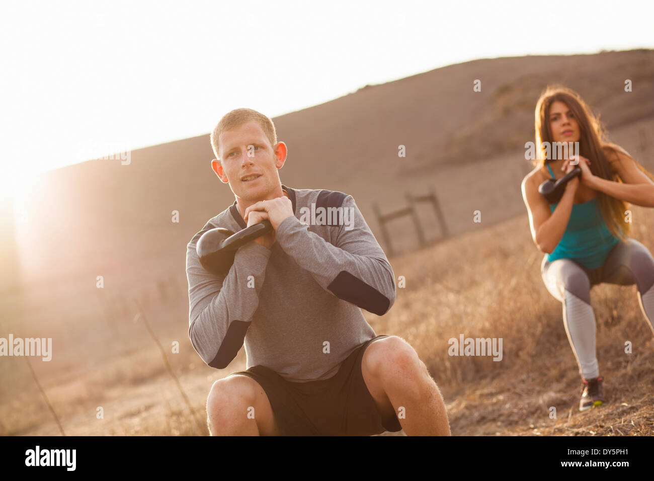 Couple working out with weights Stock Photo