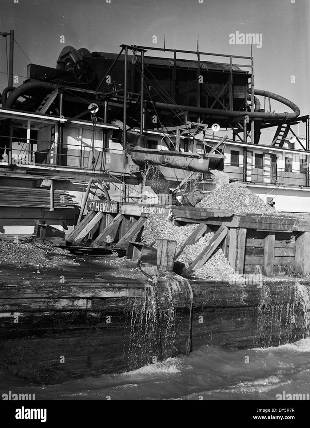 [Dredge Filling Barge with Oysters, Houston Pipe Line Company] Stock