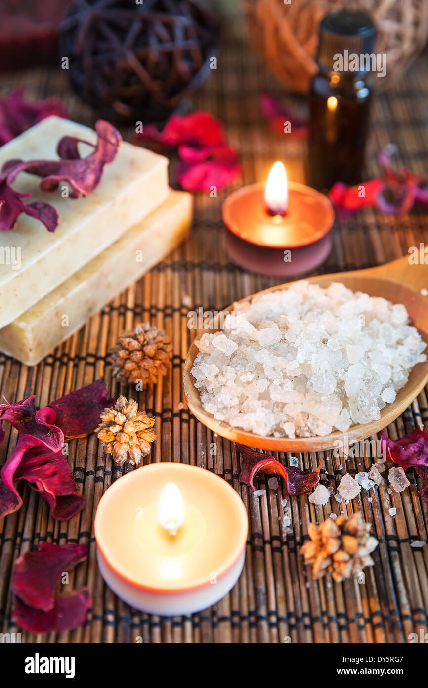 Spa with natural bath salt, candles, soap, towels and petals Stock Photo
