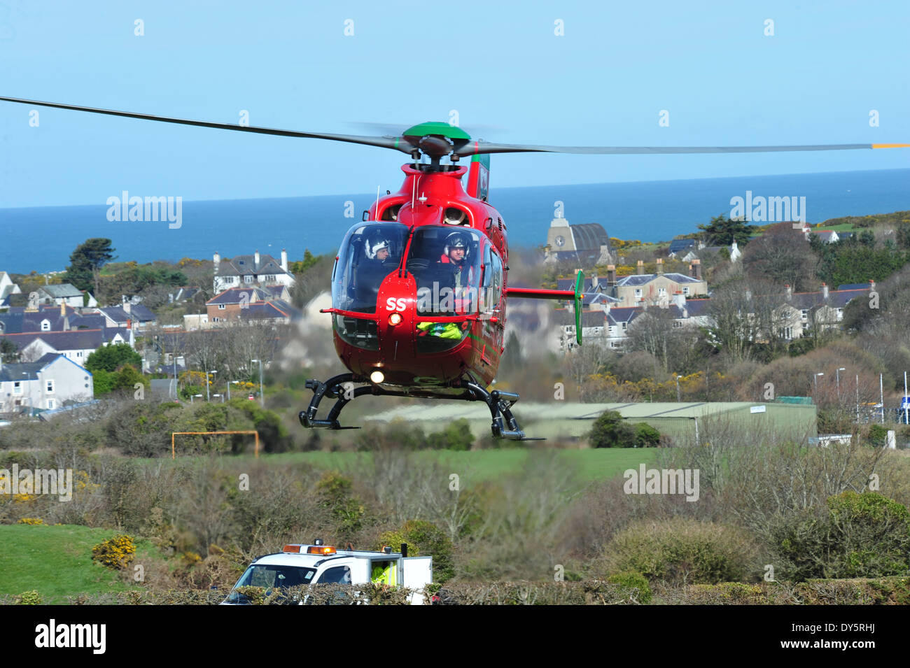 Wales Air Ambulance Attending an Rta At Amlwch Anglesey North Wales Uk flying G-Wass welsh aircraft helicopter Stock Photo