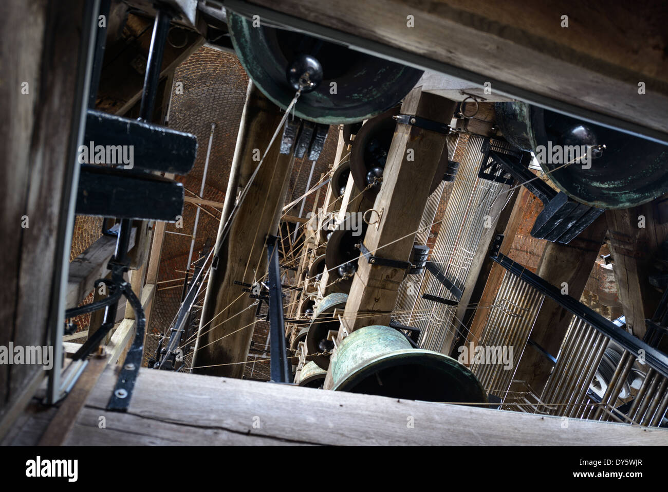 BRUGES, Belgium - Some of the many Carillon bells that chime in the tower of the Belfry of Bruges. The Belfry (or Belfort) is a medieval bell tower standing above the Markt in the historic center of Bruges. The first stage was built in 1240, with further stages on top built in the late 15th century. The Carillon consists of 47 bells. 26 bells were cast by Georgius Dumery between 1742 and 1748 and 21 bells were cast by Koninklike Eijsbouts in 2010. The bourdon weights 6 tons, and the bells have a combined weight of 27 tons. Stock Photo