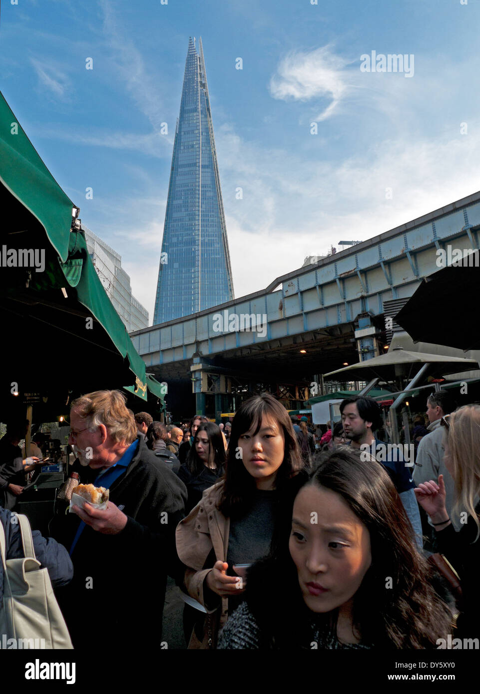 Chinese tourists visiting Borough Market and view of the Shard, London Bridge, Southwark, London, UK  KATHY DEWITT Stock Photo