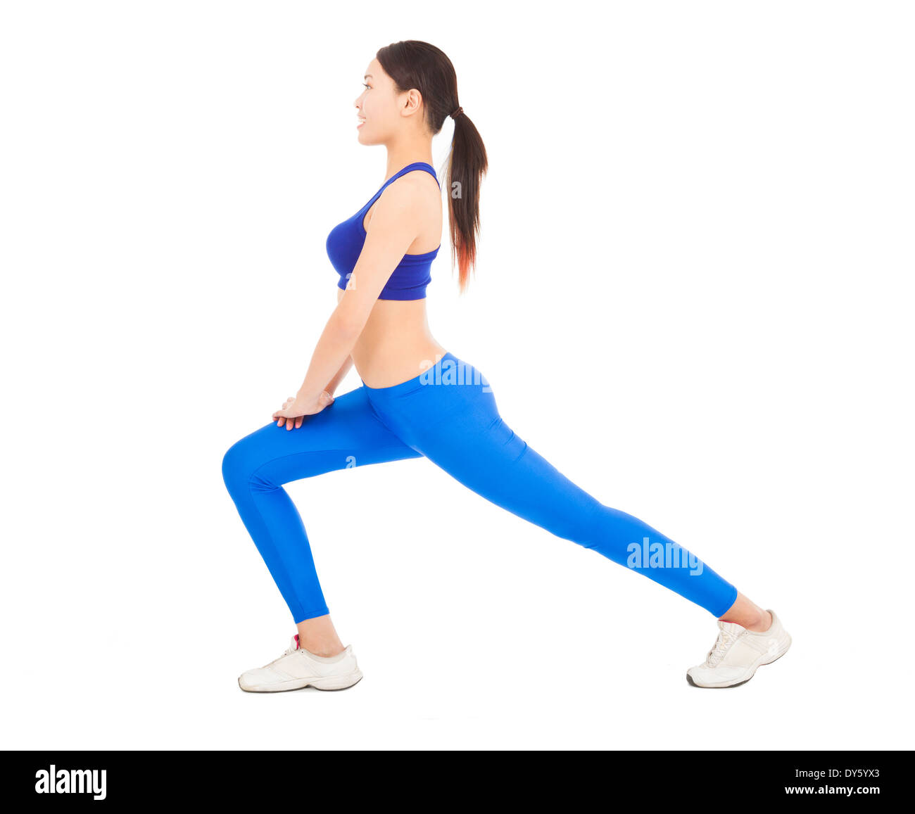 young sporty woman doing warm exercise Stock Photo