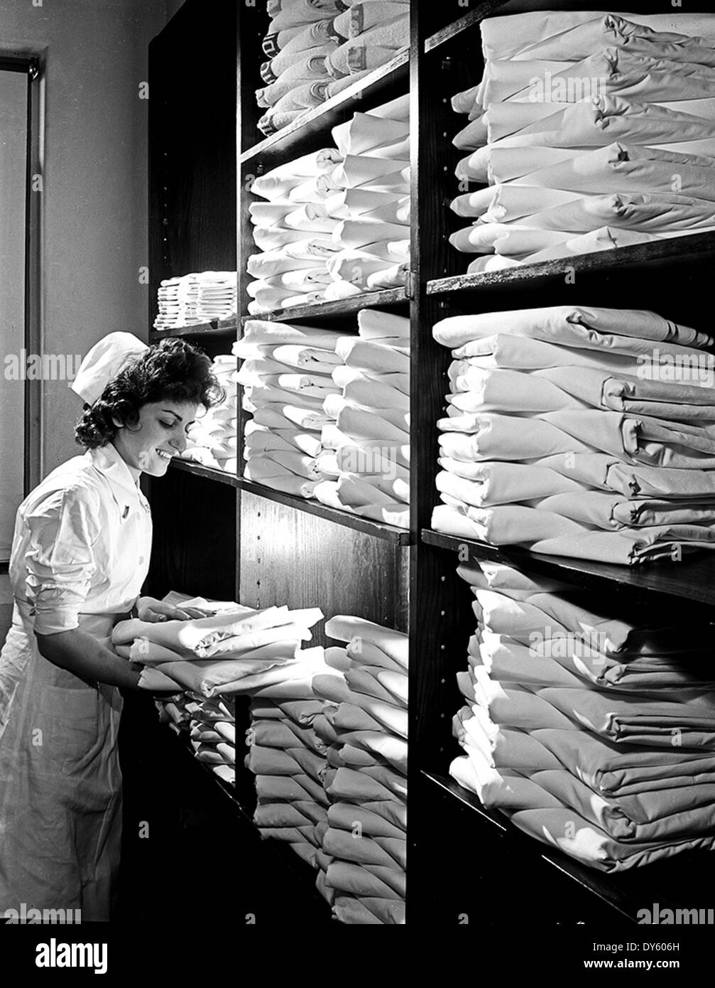 [Nurse in Hospital Linen Closet, Pepperell Manufacturing Company] Stock Photo
