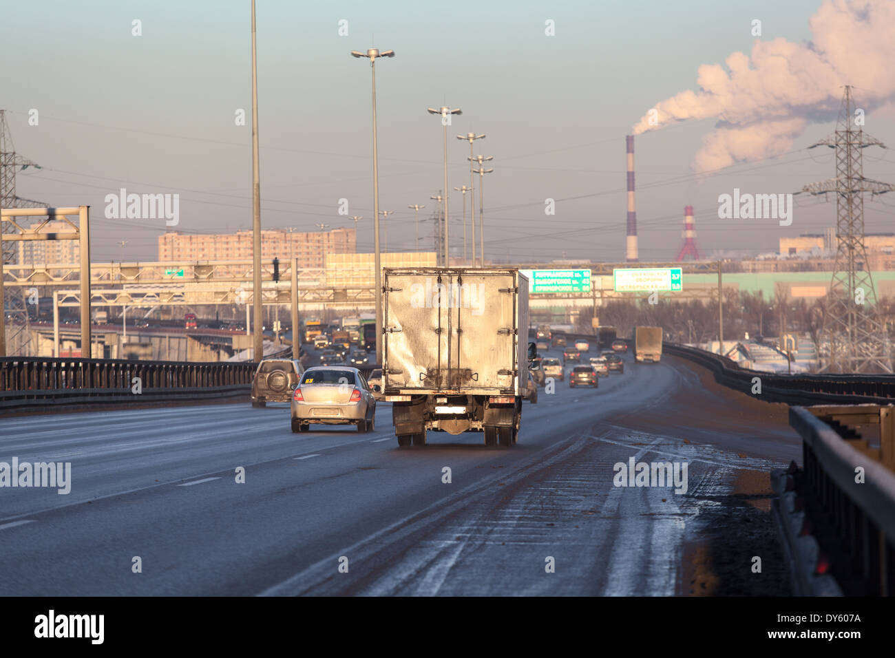 Vehicles riding on the dirty city highway at winter Stock Photo