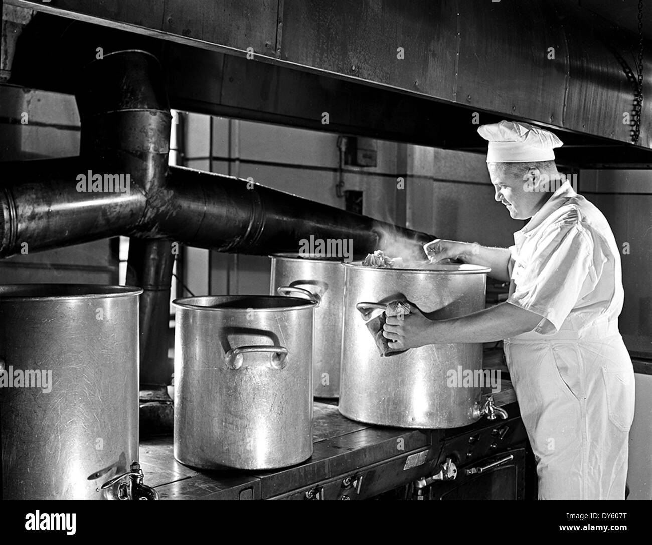 [Army Cook Steaming Cauliflower, Pepperell Manufacturing Company] Stock Photo