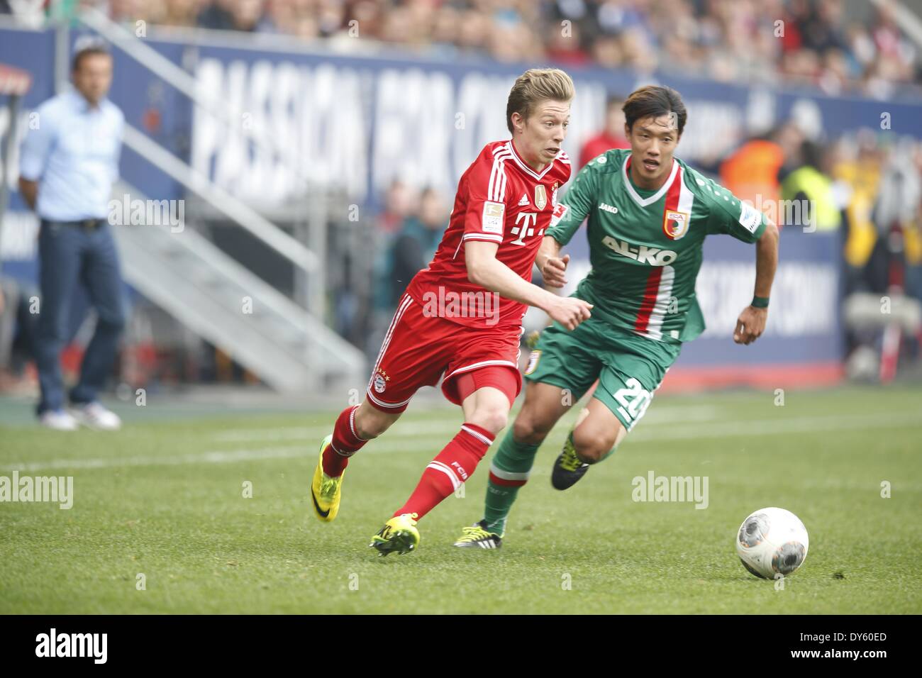 the SGL Arena, Augsburg, Germany. 5th Apr, 2014. (L-R) Mitchell Weiser (Bayern), Hong Jeong-Ho (Augsburg), APRIL 5, 2014 - Football/Soccer : German 'Bundesliga' match between Augsburg and Bayern Munchen, at the SGL Arena, Augsburg, Germany. Credit:  AFLO/Alamy Live News Stock Photo
