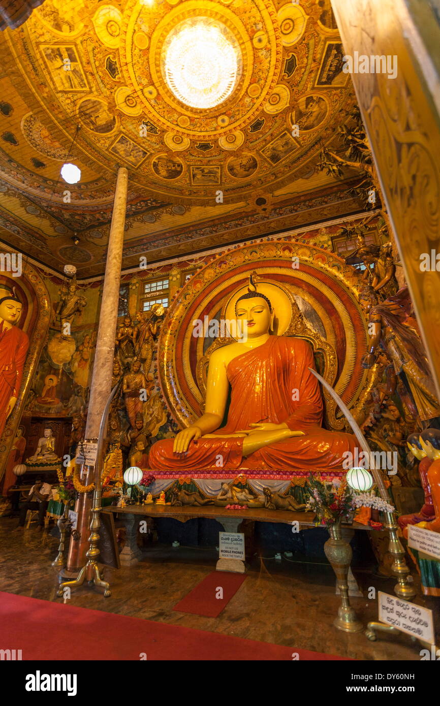 Large Buddhist statue at Gangaramaya Temple, Colombo, Sri Lanka, Asia Stock Photo