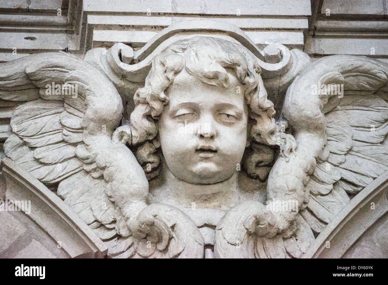 BRUSSELS, Belgium — A cherub atop one of the internal columns at the Church of Saint John the Baptist at the Béguinage, 17th century Flemish Baroque style Roman Catholic Church in central Brussels, Belgium. It was originally part of the beguinage Notre-Dame de la Vigne. Stock Photo