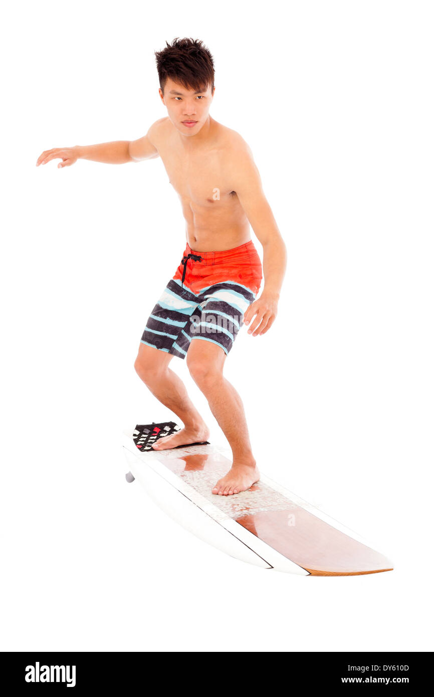 young surfer simulate surfing pose Stock Photo