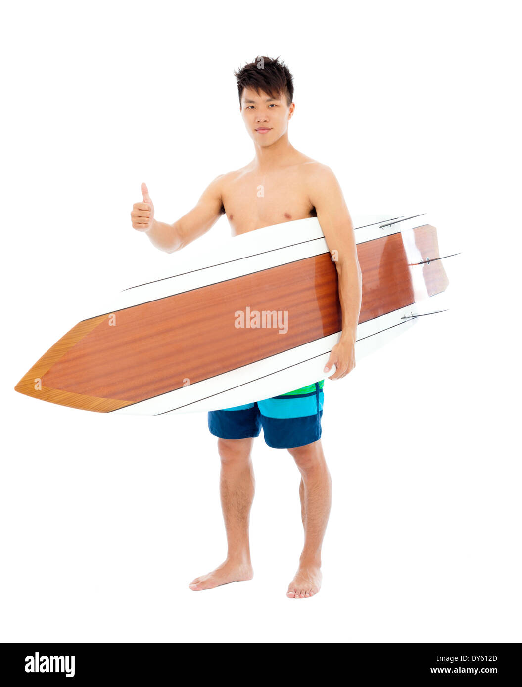 young surfer holding a surfboard and thumb up Stock Photo